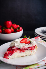 Slice of Strawberry Cream Pie with Whipped Cream: Piece of strawberry pie topped with whipped cream and fresh strawberries