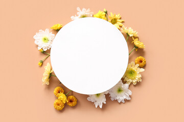 Blank card with beautiful chrysanthemum flowers on brown background