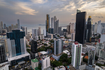 Fototapeta na wymiar Beautiful aerial view of Panama City, its skyscraper buildings, the Cinta Costera at Sunset