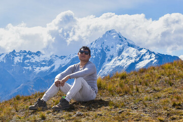 Happy man on top of mountain watching the snowy Veronica on the way from Intipunku to Perolniyoc Cusco, Ollantaytambo