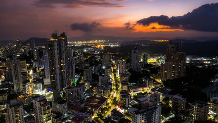 Beautiful aerial view of Panama City, its skyscraper buildings, the Cinta Costera at Sunset