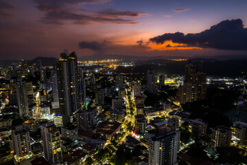 Beautiful aerial view of Panama City, its skyscraper buildings, the Cinta Costera at Sunset