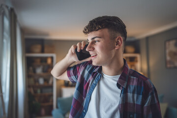 One man caucasian male teenager boy use mobile phone smartphone