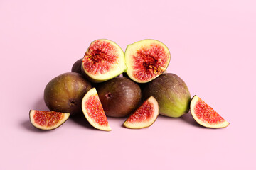 Fresh ripe figs on pink background