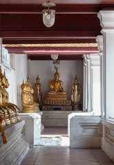 Diminishing perspective interior view at corridor around the Wat yai suwannaram temple is leading to Buddha statue. Selective focus.