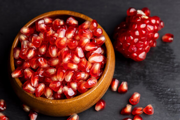 Red ripe pomegranate with red and juicy grains