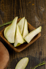 sliced pieces of green pear on the table