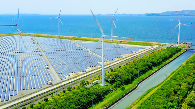 Solar power plant and Windmills aerial view. Renewable energy. Green tech.