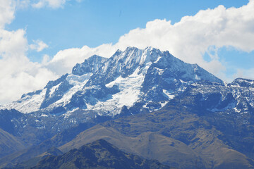 Panoramic view of the Andes mountain range with few snowfalls in the town of Chincheros in Cuzco Peru