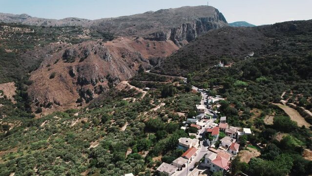 Drone view over Topolia village at Topolia Gorge canyon in Crete, Greece. High quality 4k footage