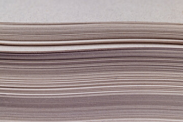 grey low-quality thin paper from recycled waste