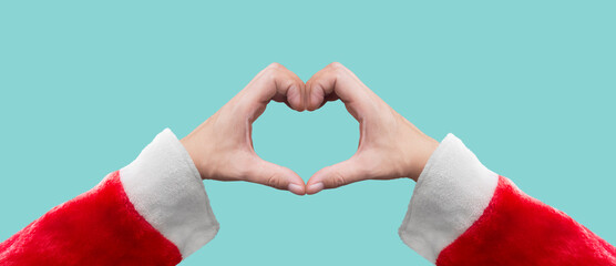 hand of a person dressed as Santa Claus forming a heart