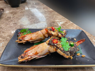 Grilled shrimp topped with tamarind sauce and chilli.