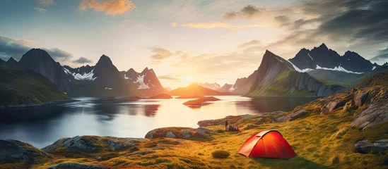 Fotobehang Camping in Lofoten Islands Tent amid mountains sunset over polar circle perfect midnight sun landscape © TheWaterMeloonProjec