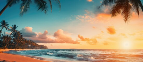 Tropical beach with palm trees against a sunset sky vintage effect peaceful nature view