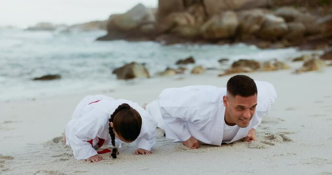 Sea, karate exercise or child learning martial arts fighting or taekwondo in fitness workout or push ups. Challenge, man or teacher teaching a kid, girl or student in training for power at a beach