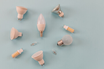 different types of light bulbs on a blue background. background for text