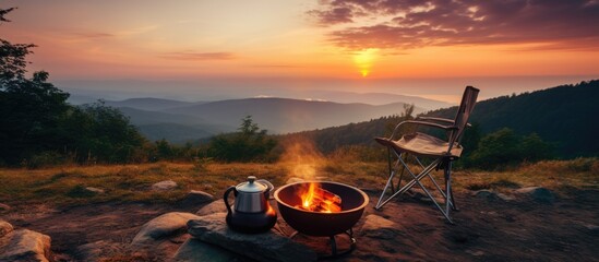 Campsite with fire pit and two tin cups with hot tea - obrazy, fototapety, plakaty