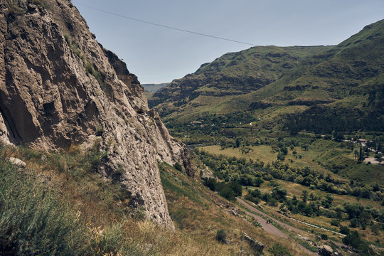 Vardzia. Ancient cave monastery town in the Erusheti mountain, located in southern Georgia. The caves stretch along the cliff. Summer time landscape