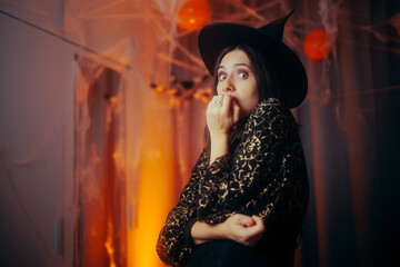 Scared Girl Having a Party on Spooky Halloween Night. Stressed woman trying to organize a celebratory event
