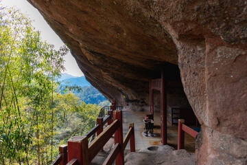 The stairs and the altar under the huge rock on Wuyishan mountain