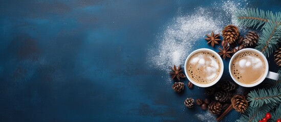 Festive coffee cups with numbers over frothy surface on rustic blue background perfect for welcoming the New Year - obrazy, fototapety, plakaty
