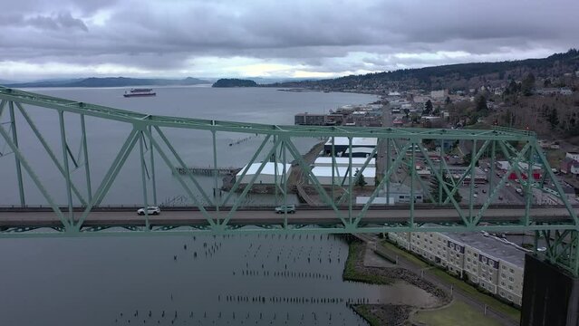 Drone flying parallel to the Astoria Megler Bridge, tracking cars crossing the bridge.