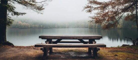 Rainy day lake picnic on a wooden table