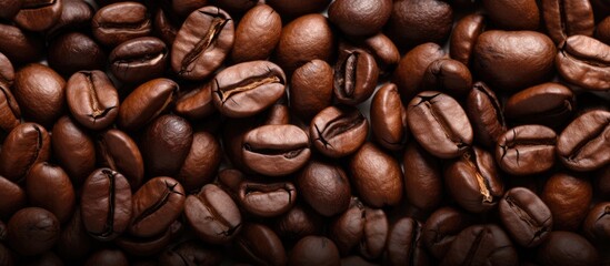 Coffee bean seen in close up against textured background - obrazy, fototapety, plakaty