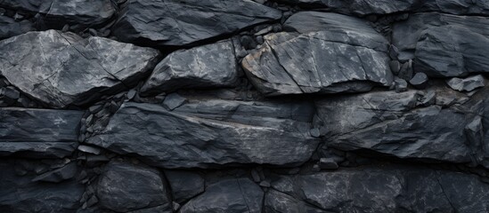 Top view of textured dark stone background with space to copy