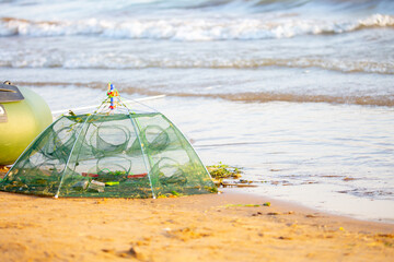 Net for catching shrimps. Fishing for seafood.