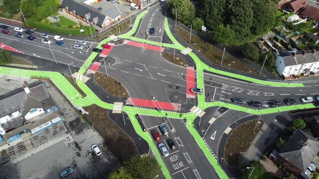 Aerial view circling vehicles travelling St Helens CYCLOPS traffic optimisation junction crossroad intersection