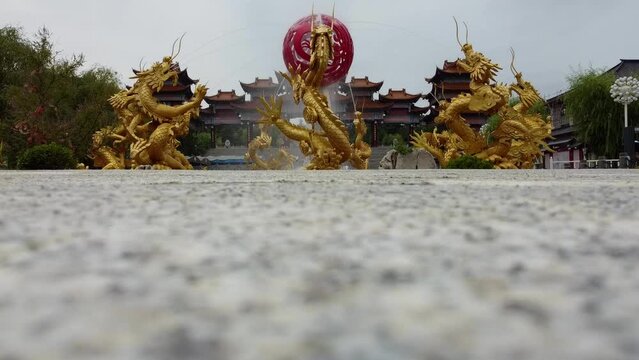 Dragon Chinese style water fountain in Weihai Huaxiacheng large-scale cultural scenic area that displays classical Eastern culture