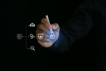 Male hand holding pen pointing at lock icon on virtual screen, security concept of data protection, cyber security.