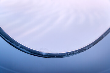 Frost forming on an airplane window, while flying nNorth Pole polar route.