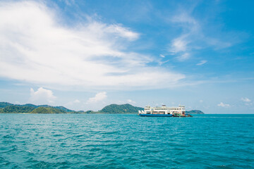 A big ship A big ship sails in the middle of the sea and the sky is beautiful. in the middle of the sea and an orange sky.
