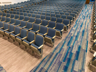 Fototapeta premium Overhead view of empty gray and blue theater, auditorium seats, chairs.