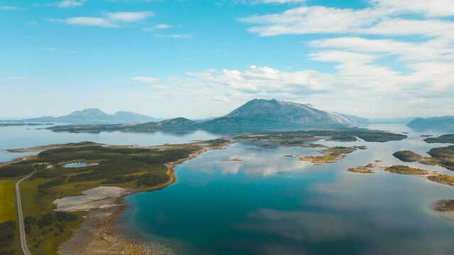 Drone flight along coastal road fv 17 near Sandnessjoen, Norway countryside