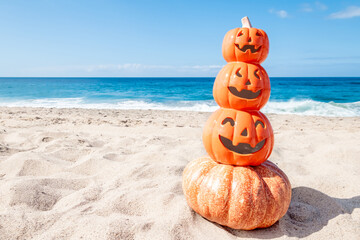 Happy Halloween background with pumpkins on the beach - 653089029