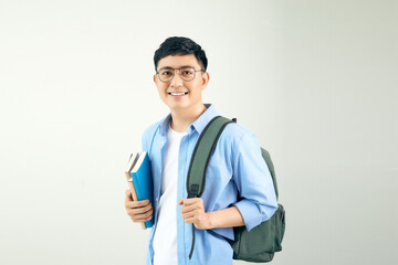 Smiling young man student with backpack hold books isolated on white background.