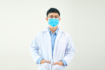 A confident young male doctor wearing a protective surgical mask