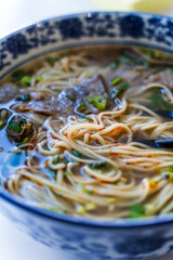Chinese noodle soup. Asian style ramen noodles with beef and broth. Chinese Asian cuisine