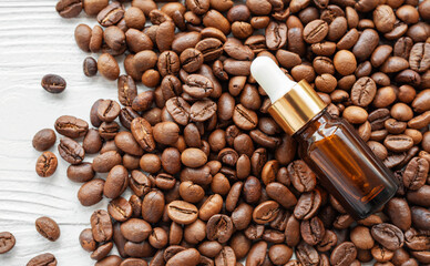 Skincare caffeine eye serum. Product bottle and coffee beans.