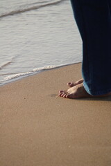 person walking on the beach