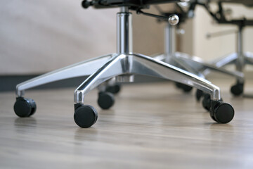 Close up chair castor wheel in modern office meeting room or business working
