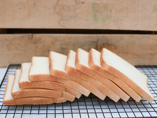 Fototapeta na wymiar sliced white bread on cooling rack