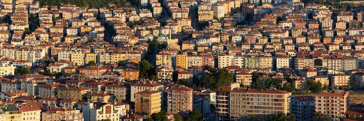 Fototapeta na wymiar Detailed panoramic view to residential districts of Ankara at sunset. Banner