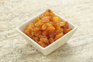 Sweet yellow raisin in the bowl