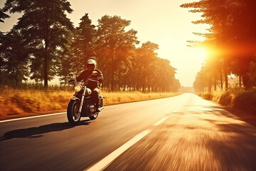 motorbike running on asphalt road in countryside at sunset