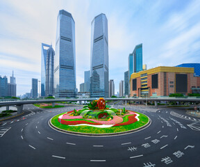 financial buildings in the Bund of Shanghai and moving bus on the highway